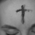 Woman with a cross of ashes on her forehead