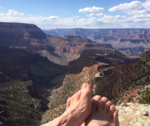 Bare feet overlooking the Grand Canyon